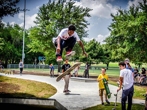 Kids watching skater perform tricks